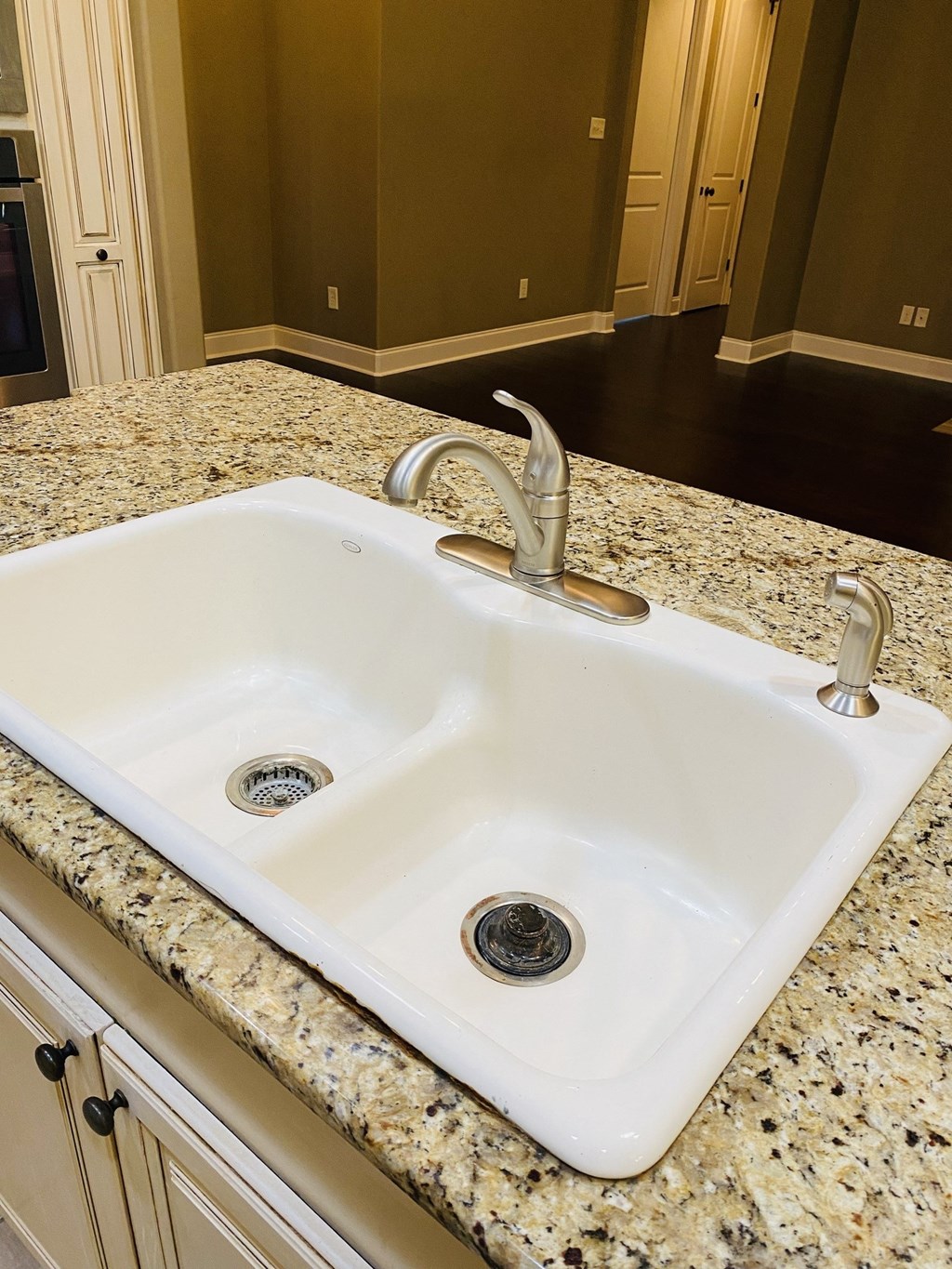 a white sink sitting on top of a kitchen counter