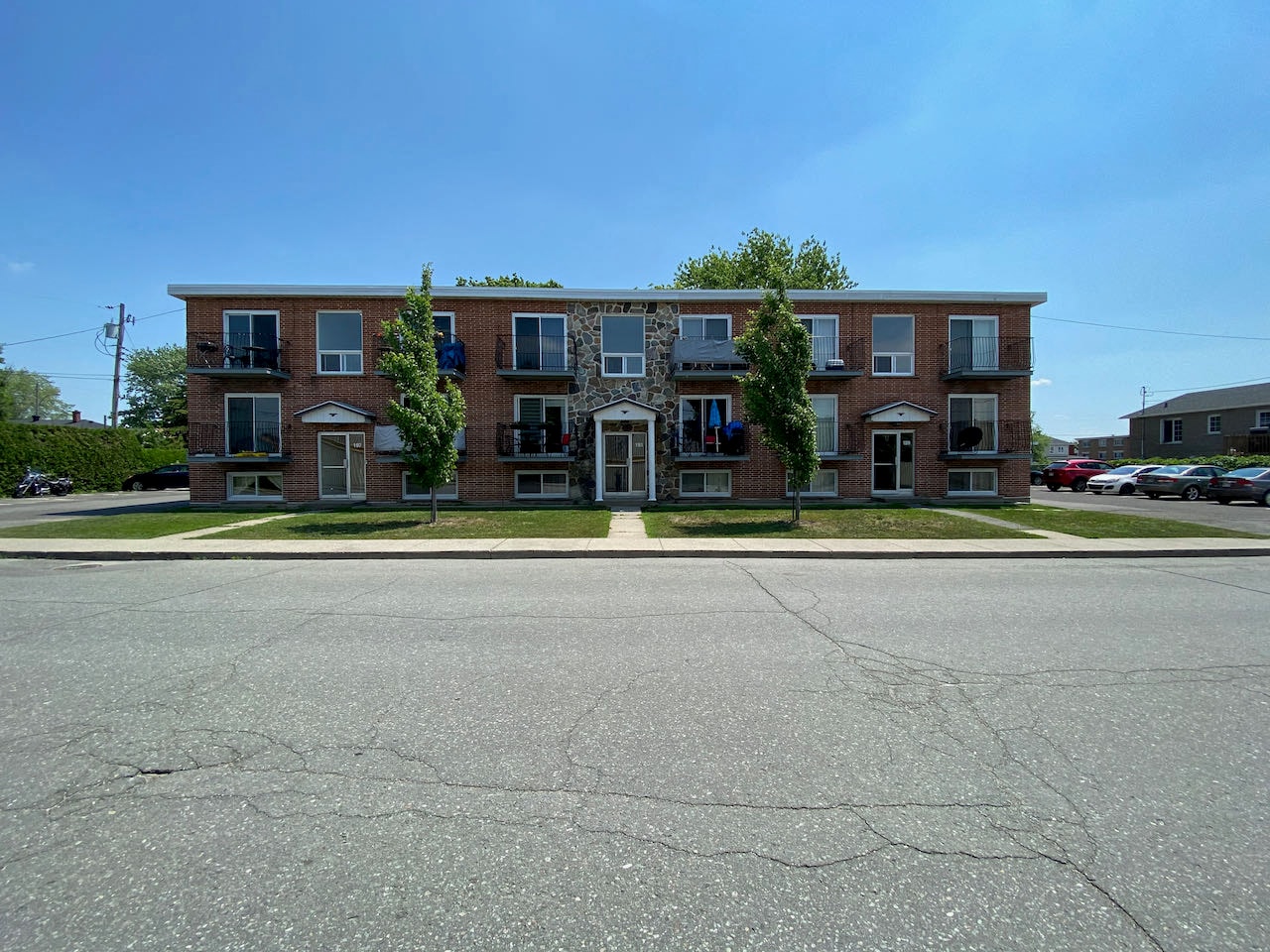 an apartment building on the corner of a street