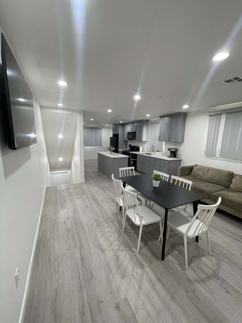 a living room and dining room in an apartment