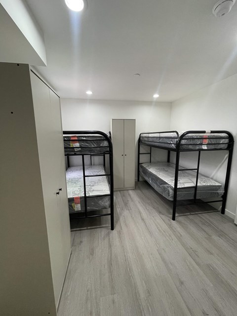 a room with bunk beds in a small room