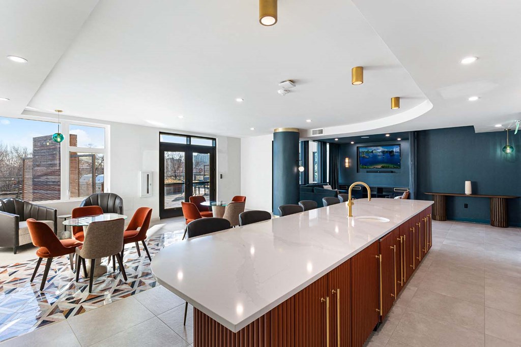 a kitchen with an island and a table with chairs