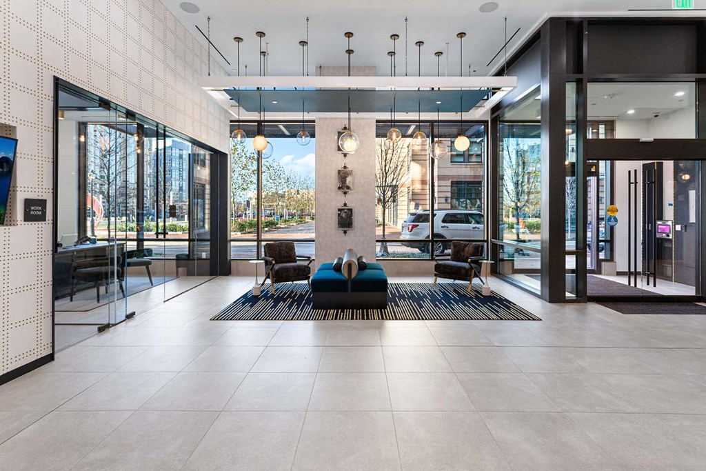 the lobby or reception area of an office building with glass doors
