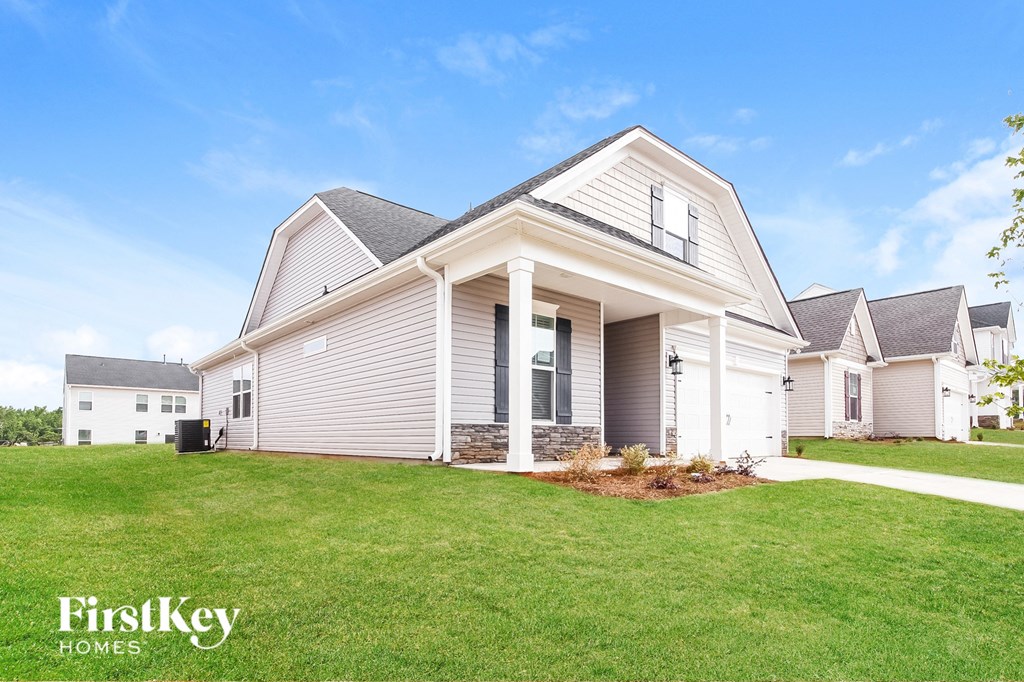 a house with a lawn in front of it