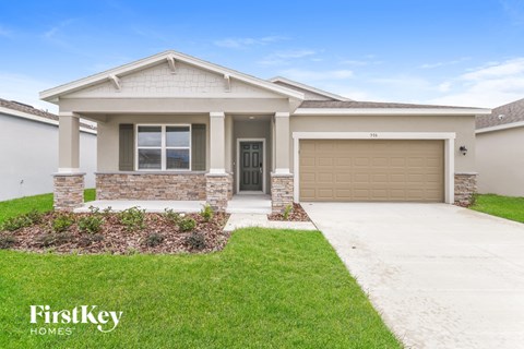a brand new house with a driveway and a garage door