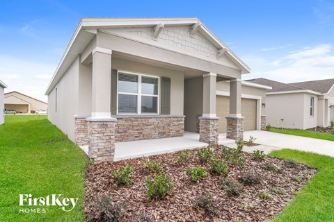 a home with a front porch and a lawn