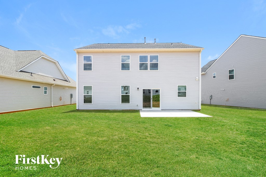 A white house with a red line on the ground in front of it.