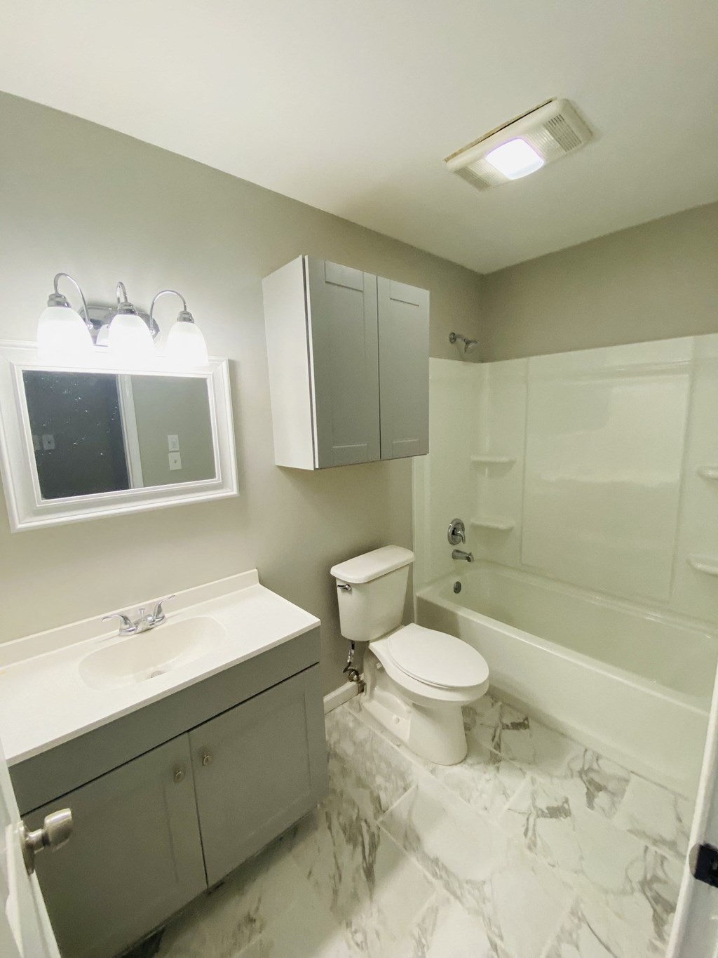 a bathroom with a sink toilet and a bath tub