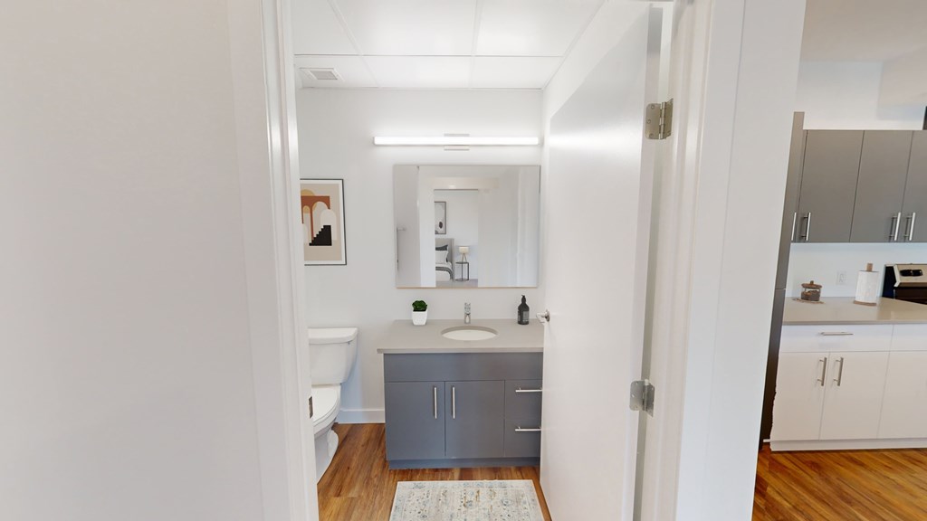 A bathroom with a sink and a toilet.