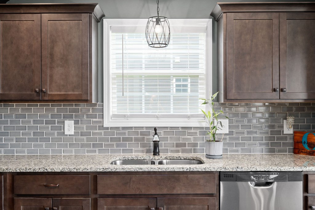 a kitchen with a sink and a window