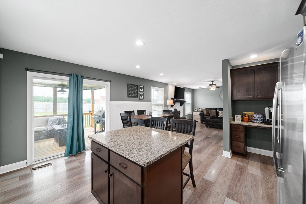a kitchen with a granite counter top and a island in the middle