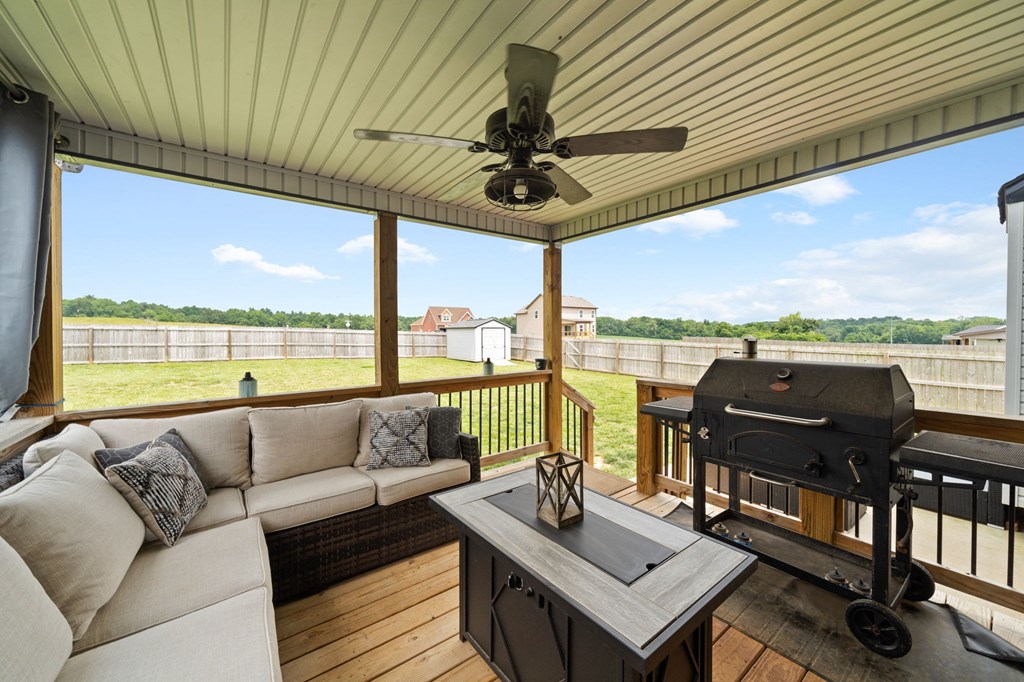 a screened in porch with a grill and a couch