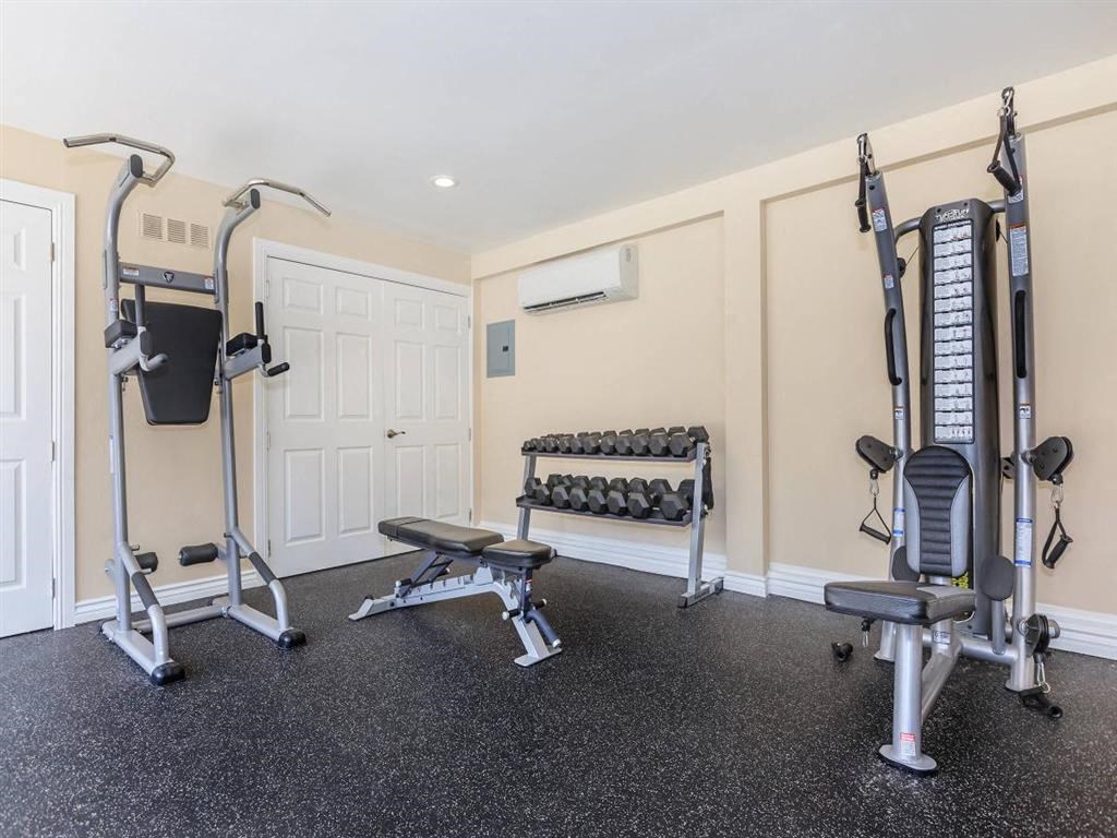 a home gym with weights and exercise equipment