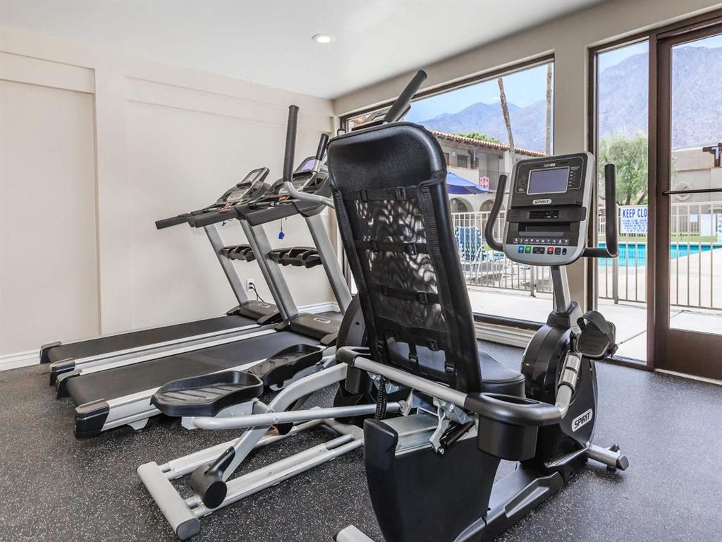 the gym has a view of the pool