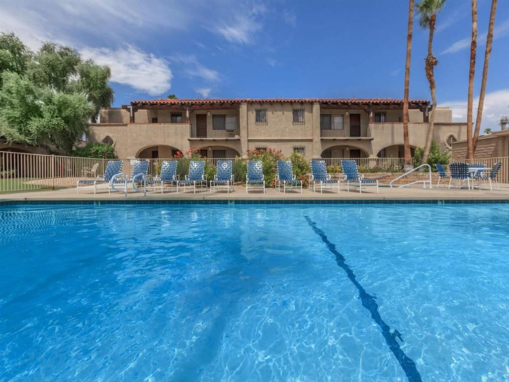 the swimming pool at the resort on a sunny day