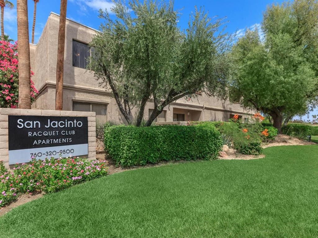 a building with a sign apartments