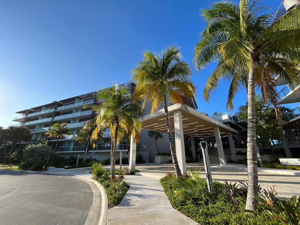 a building with palm trees in front of it