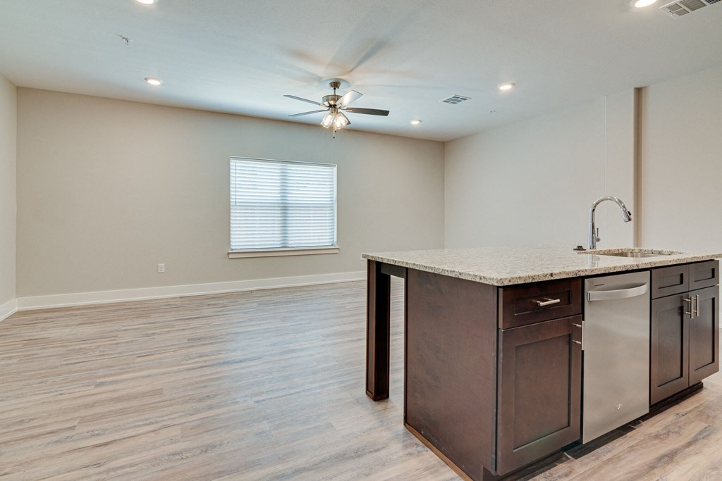 the kitchen is open to the living room and boasts a large island