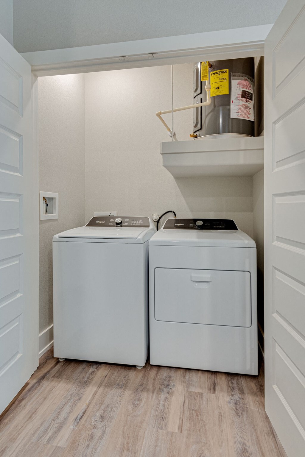 a laundry room with two washes and a dryer in it
