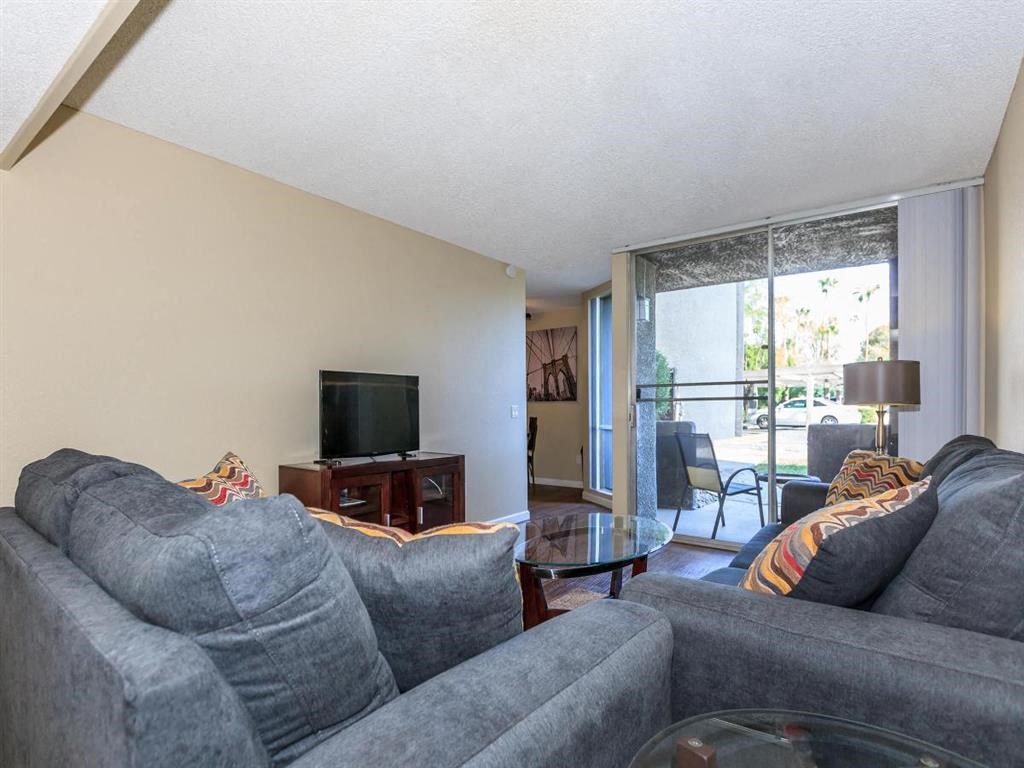 a living room with a couch and a tv