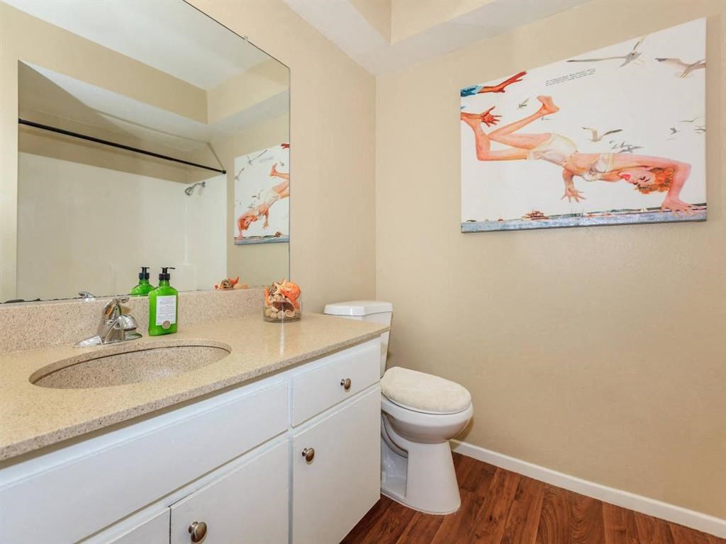 a bathroom with a sink and a toilet and a mirror