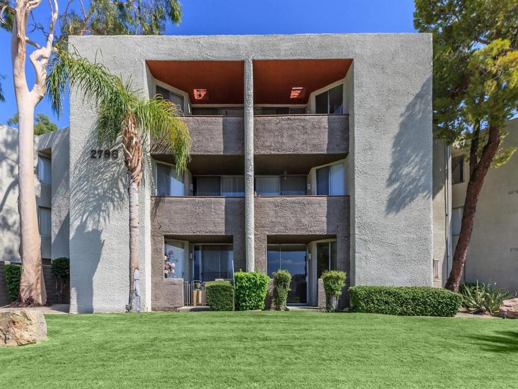 a building with a palm tree in front of it