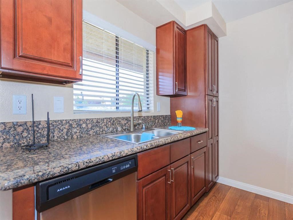 a kitchen with a sink and a window