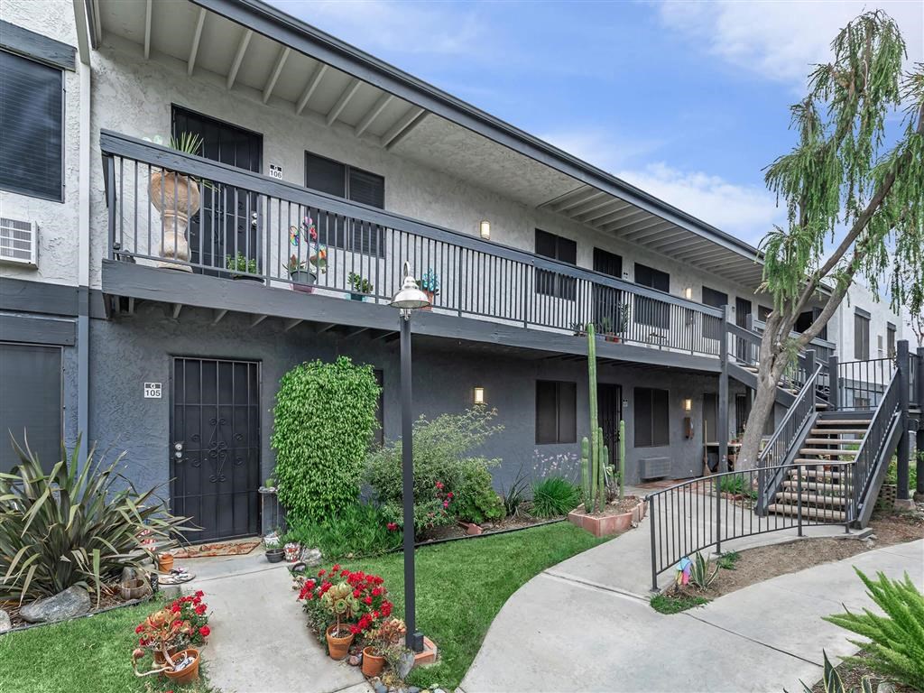 a building with a balcony and a staircase