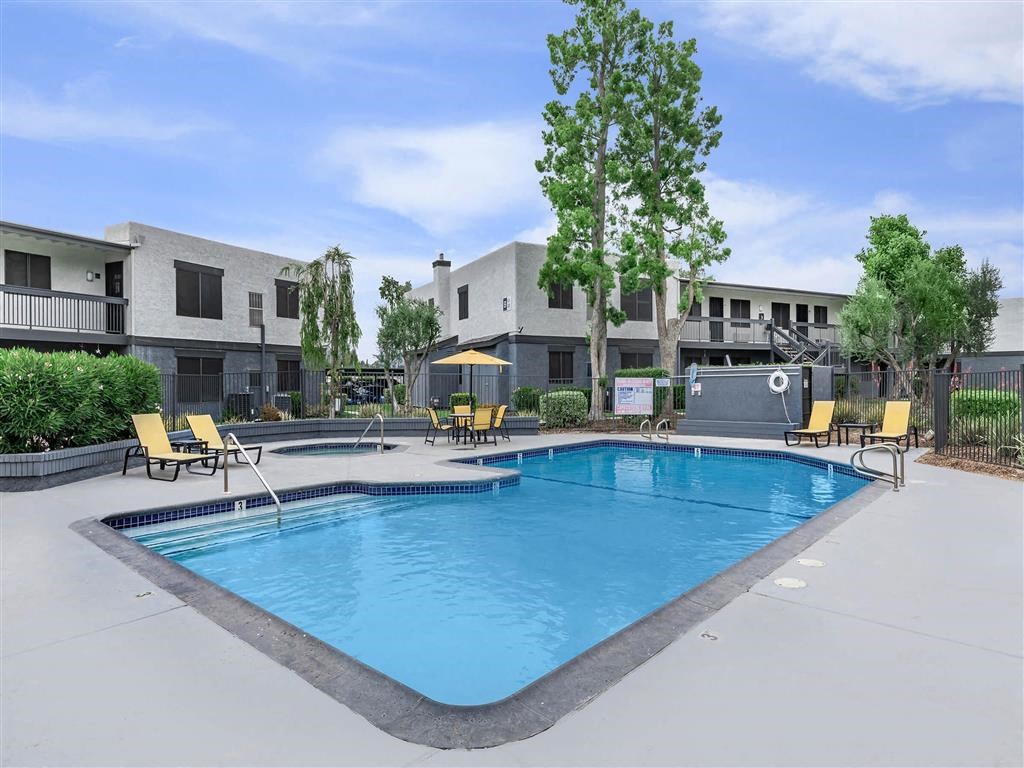 our apartments have a large pool and lounge chairs