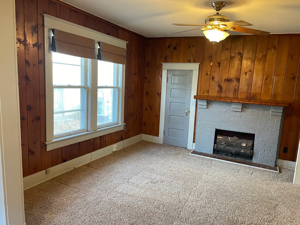 the living room of a house with a fireplace