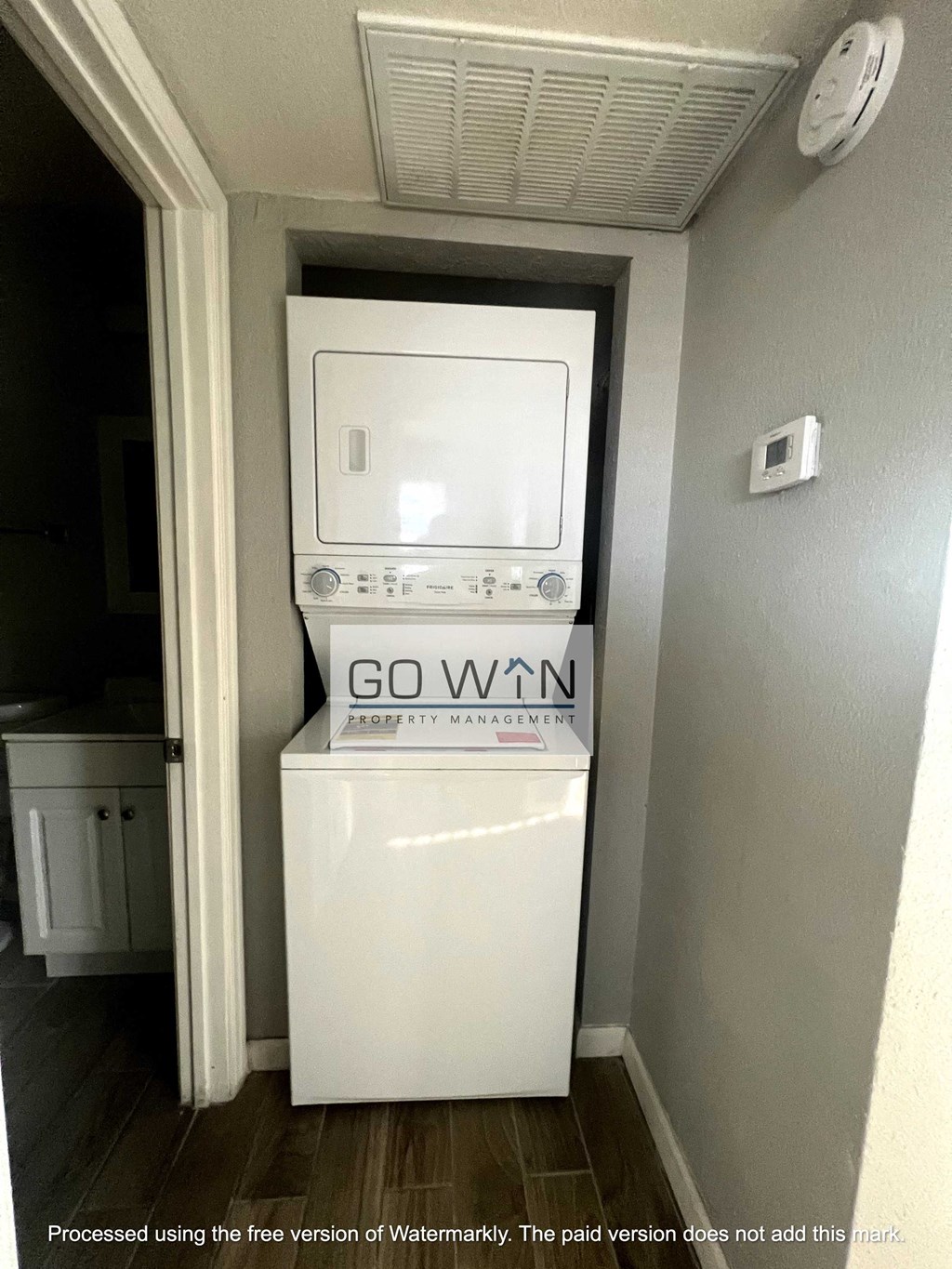 a laundry room with a washer and dryer in it