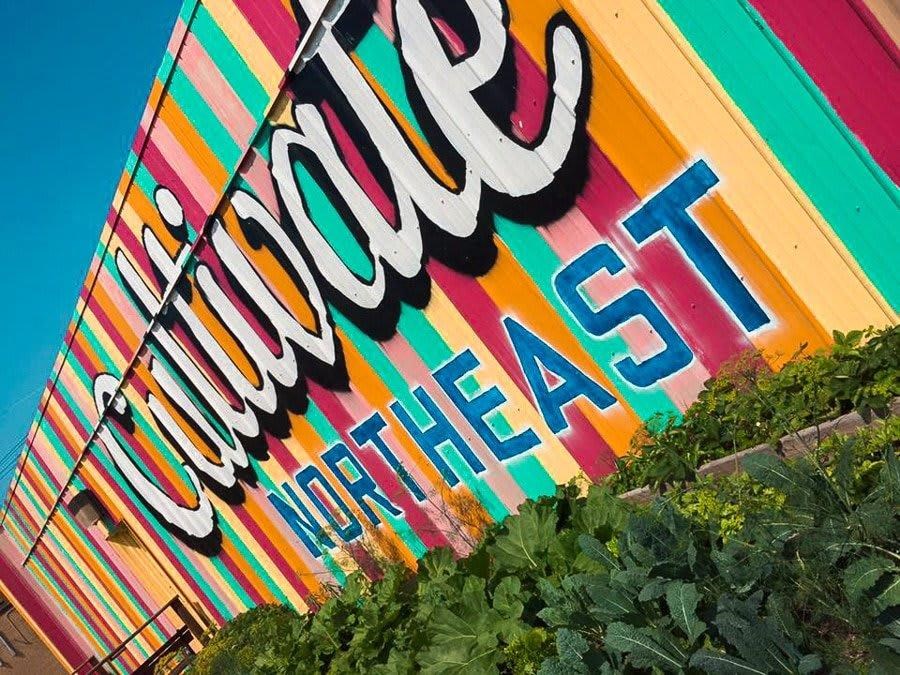 a colorful sign on the side of a building