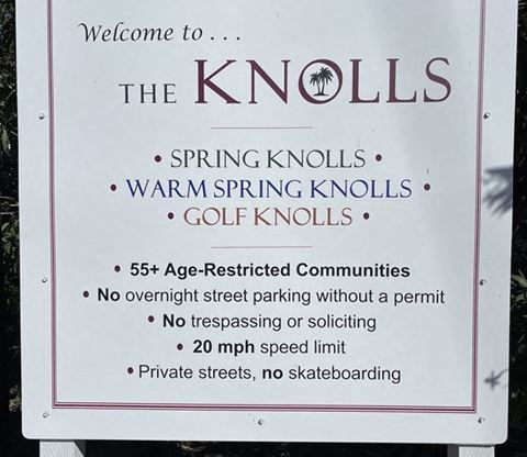 a sign that says spring knolls warninginning knolls golf knolls
