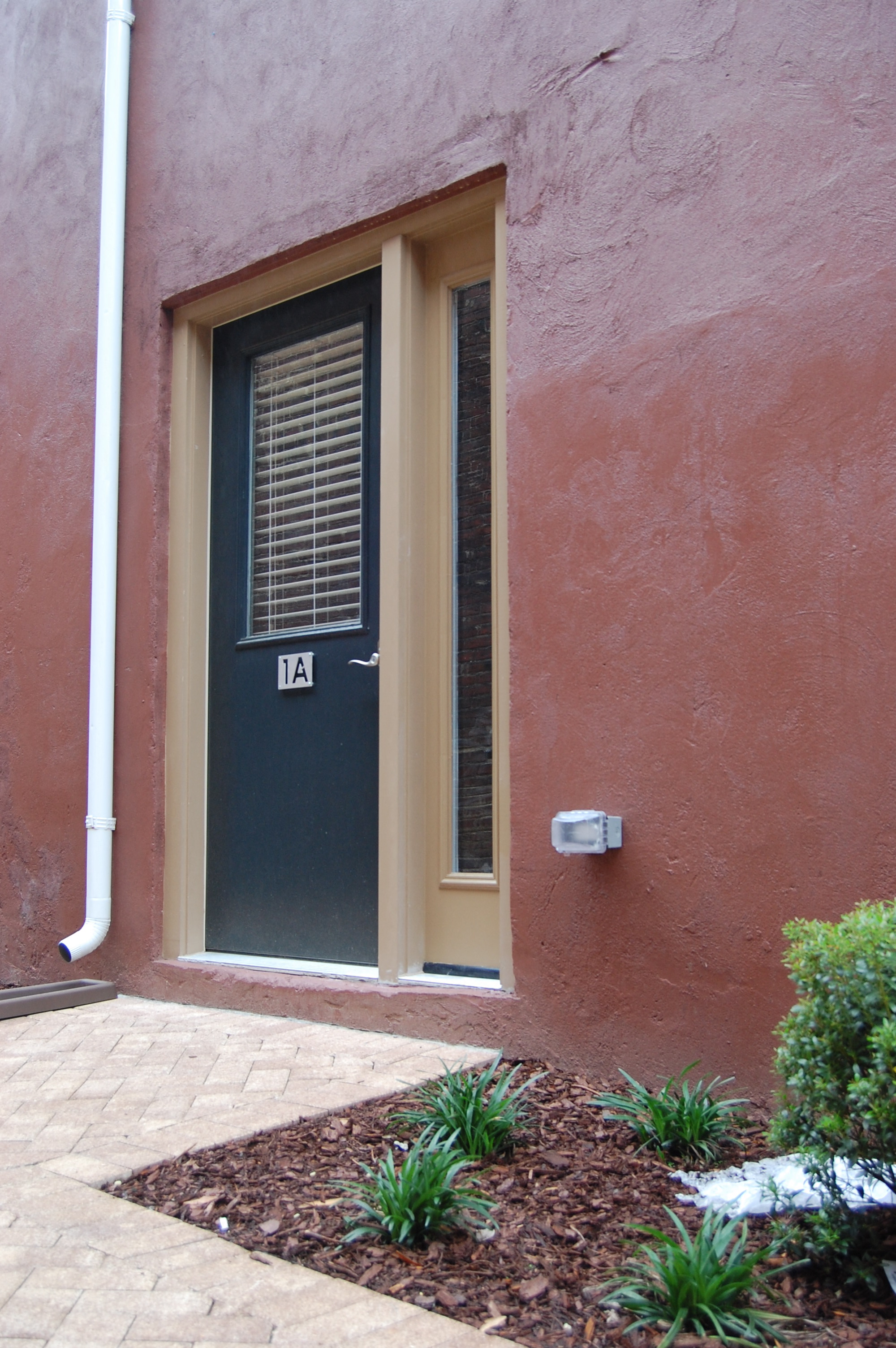 the front door of a house with a black door