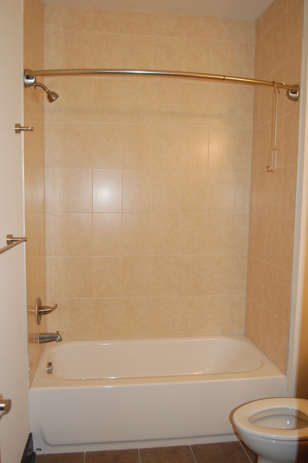 a bathroom with a shower and a toilet