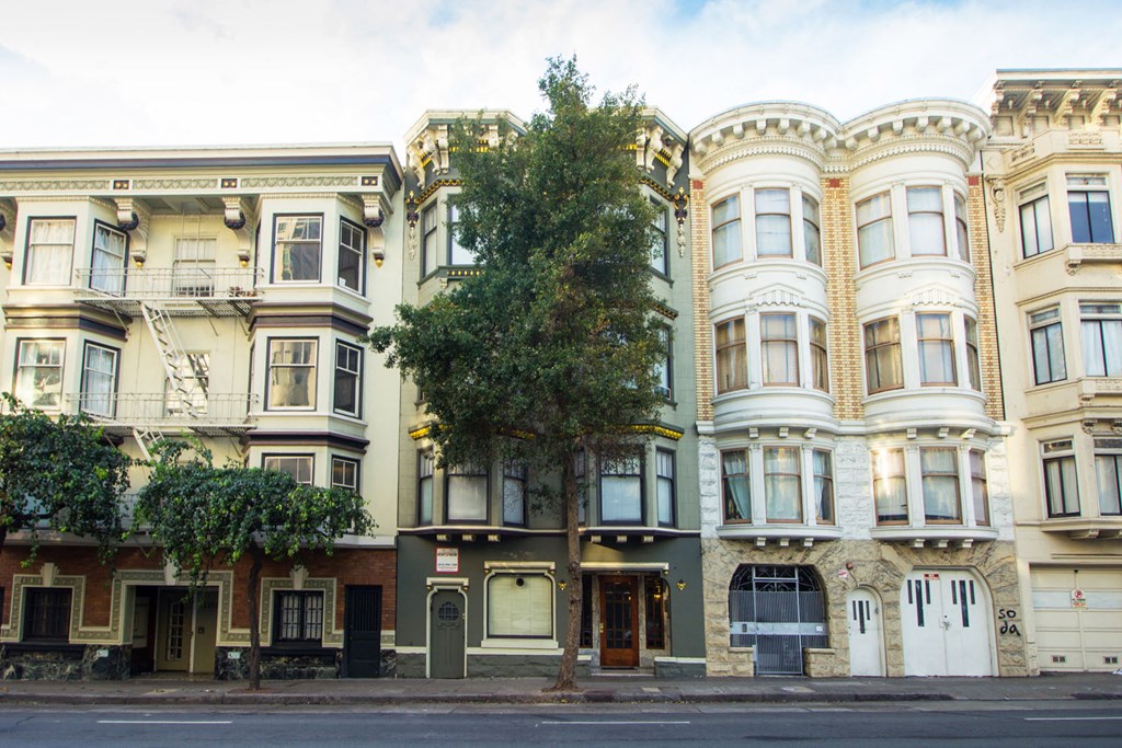 a row of buildings on a city street