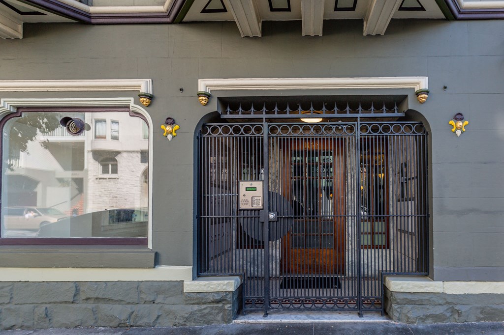 the front door of a building with a security gate