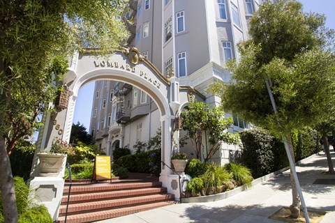 A white archway with the words "Logan's Way" on it.