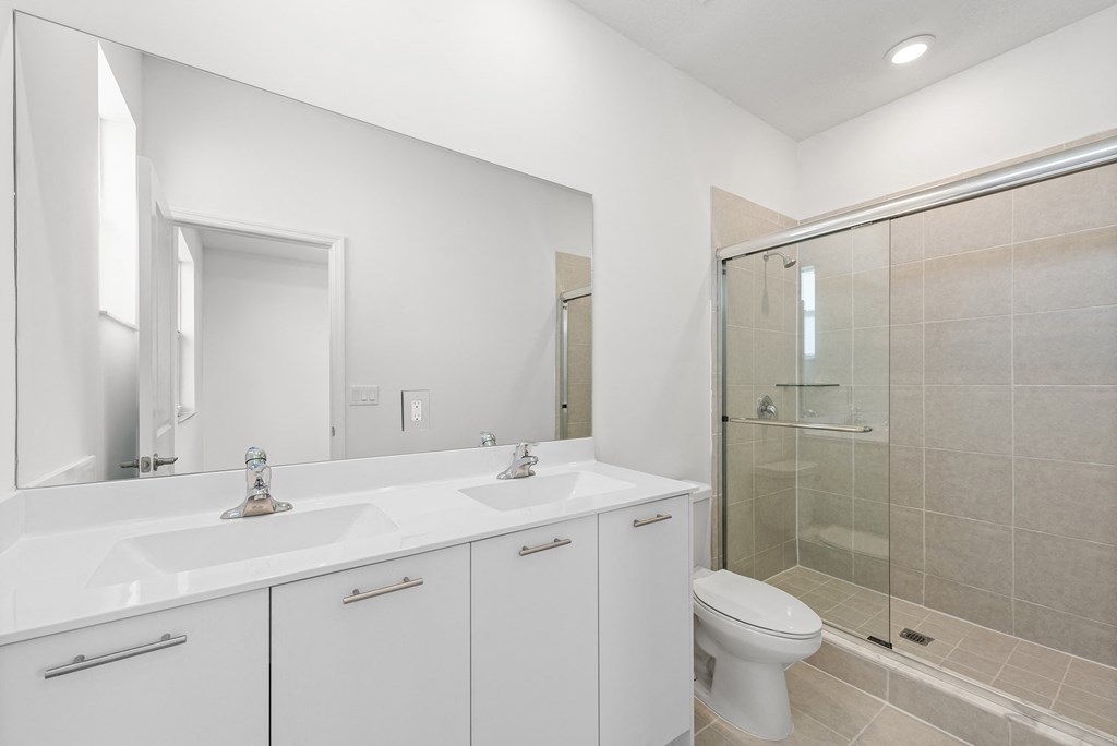 a bathroom with a sink toilet and a shower