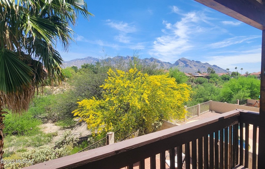 a view of the desert and mountains from a balcony