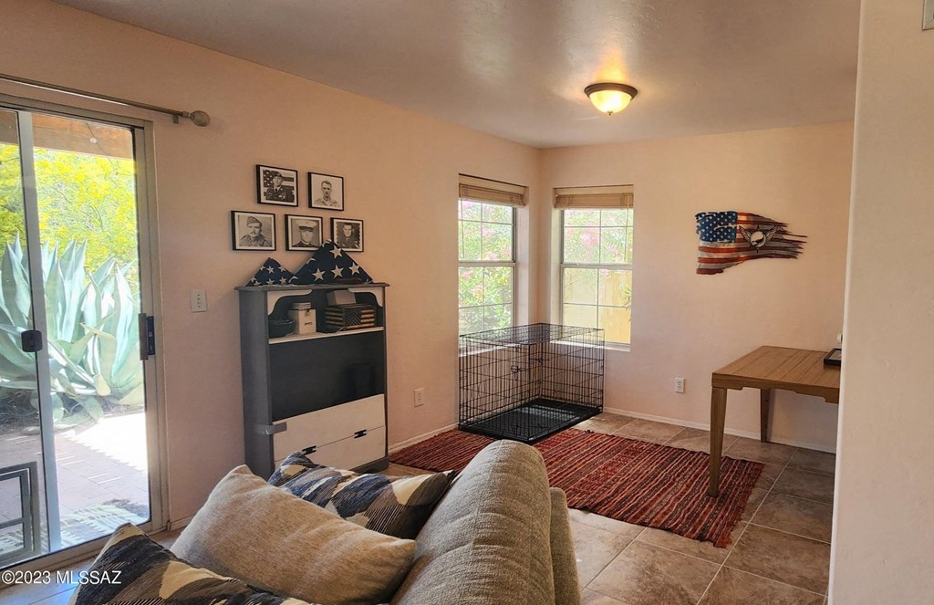 a living room with a couch and a tv