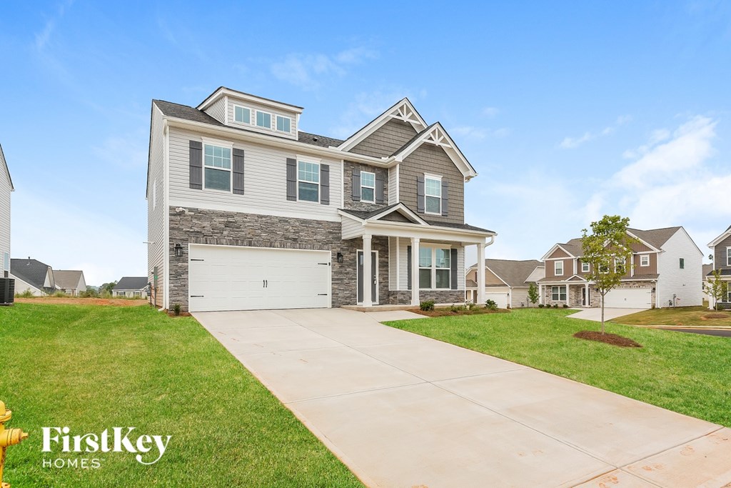 A large house with a garage is for sale.