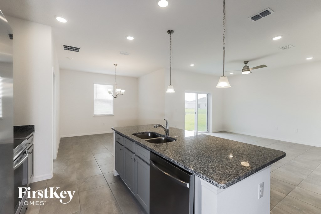 a kitchen with granite counter tops and a sink