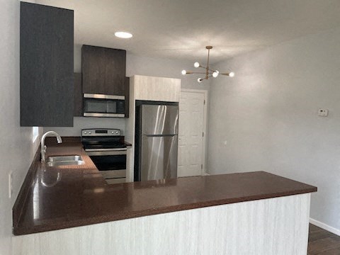 a kitchen with a counter top and a refrigerator