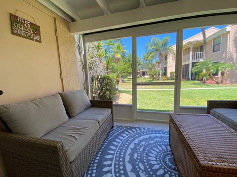 a living room with a couch and a rug