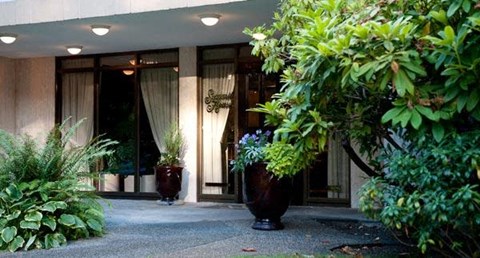 A building entrance with a sign that says "Sophisticated".