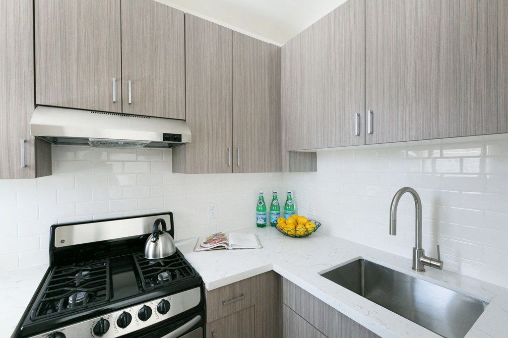 a kitchen with a stove and a sink