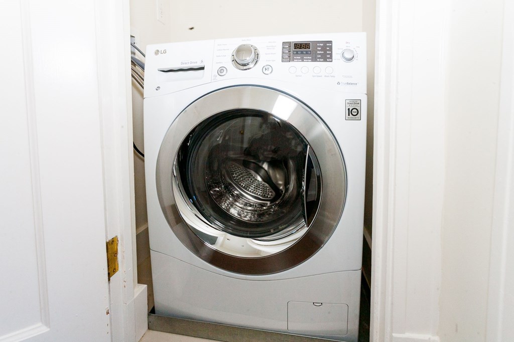 a white washer and dryer in a laundry room