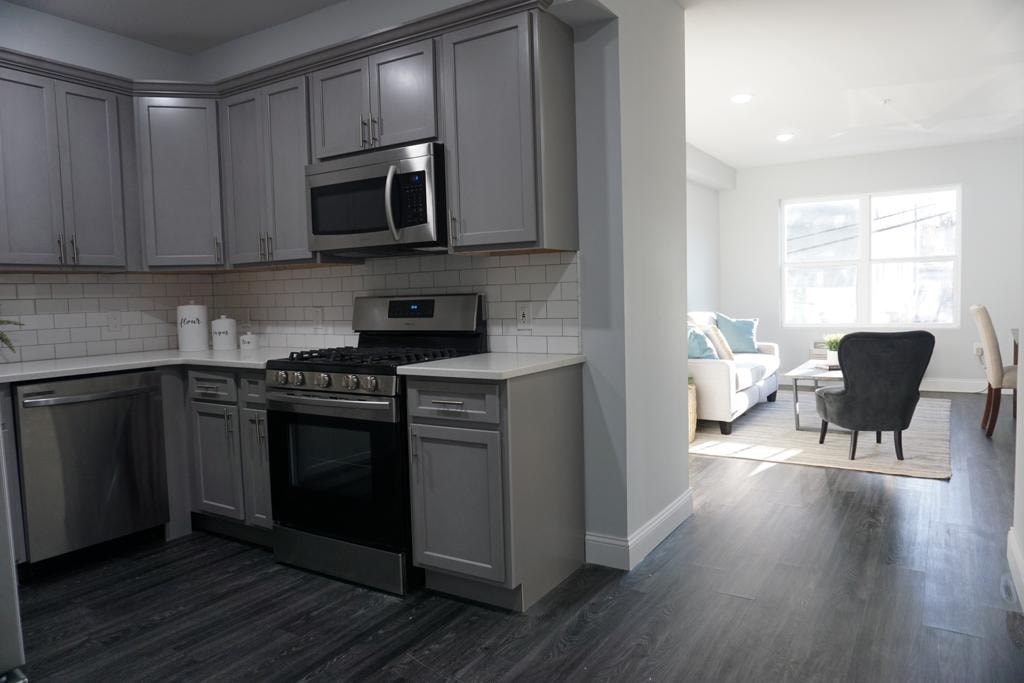 a kitchen with a stove and a microwave