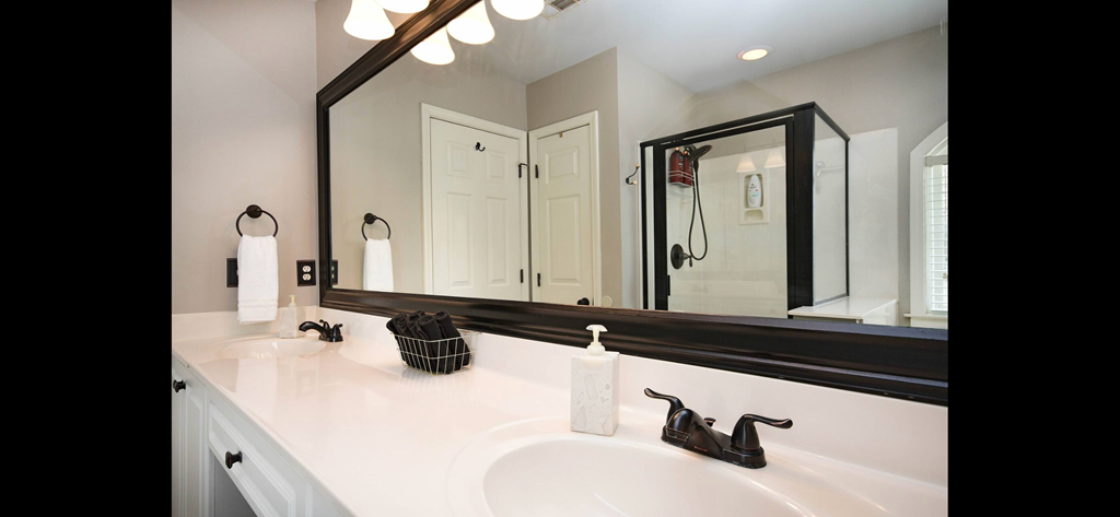 a bathroom with a sink and a mirror