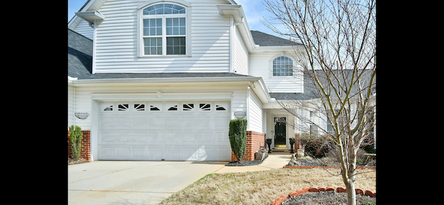 a white house with a white garage door